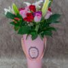 Pink & Red Roses, Tiger Lilies, Berries Flowers and Baby Breath in a Pink Vase.