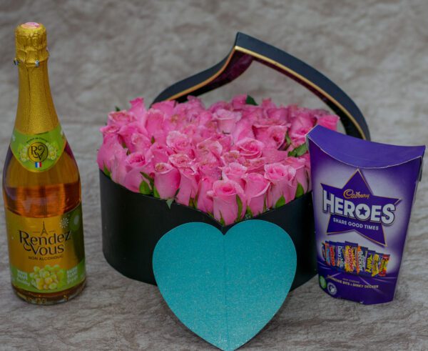 Aurora Flower Box- Pink Roses and Cadbury Heroes Chocolates and Rendez Vous White Grape Sparkling Drink- Non-Alcoholic